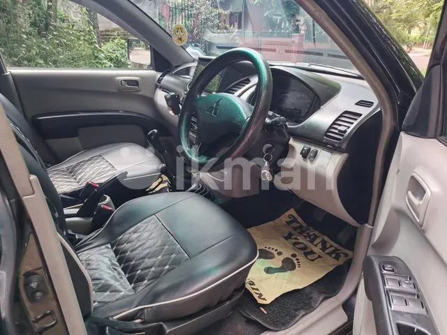 Mitsubishi L200 2011 photo 2
