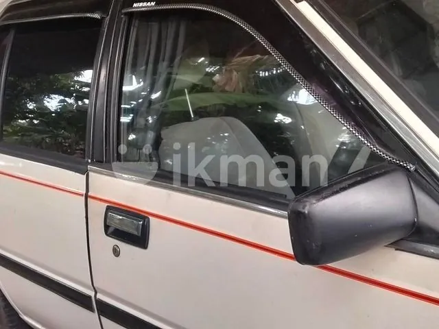 Nissan B11 1985 photo 3