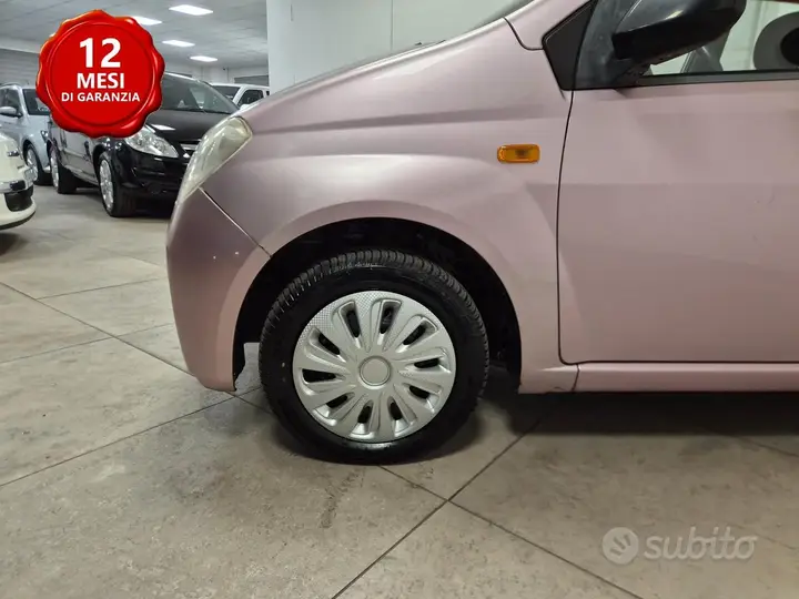 Daihatsu Cuore 2004 photo 4