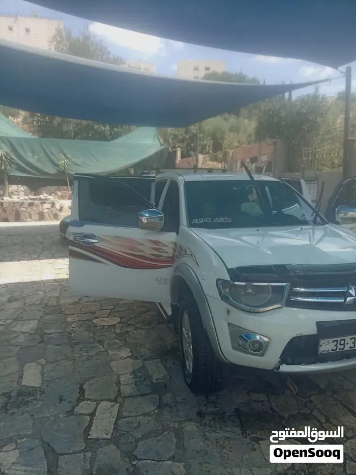 Mitsubishi L200 2012 photo 3