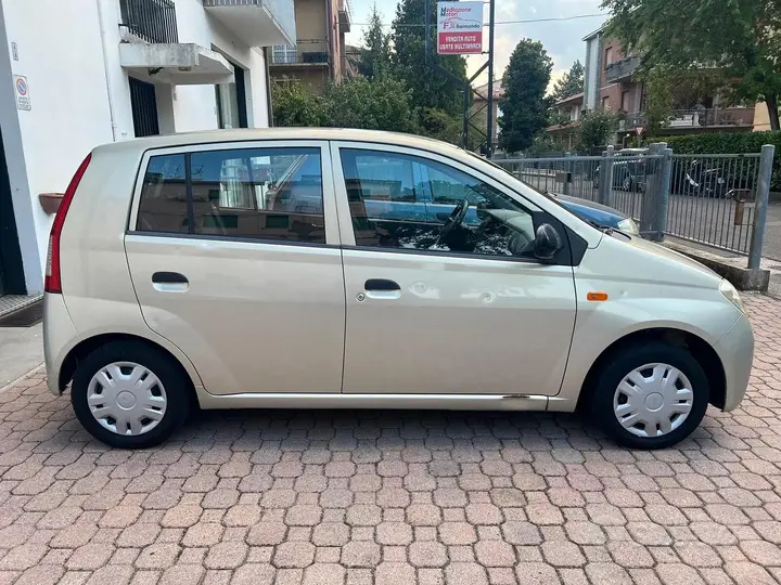 Daihatsu Cuore 2004 photo 4