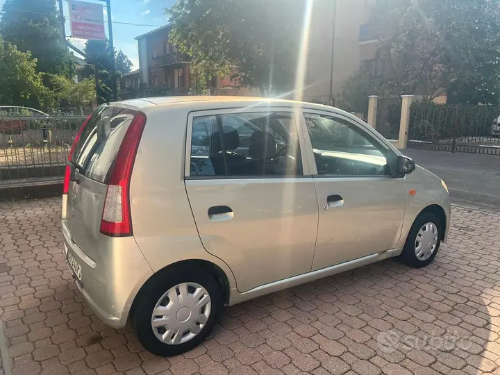 Daihatsu Cuore 2004 photo 5