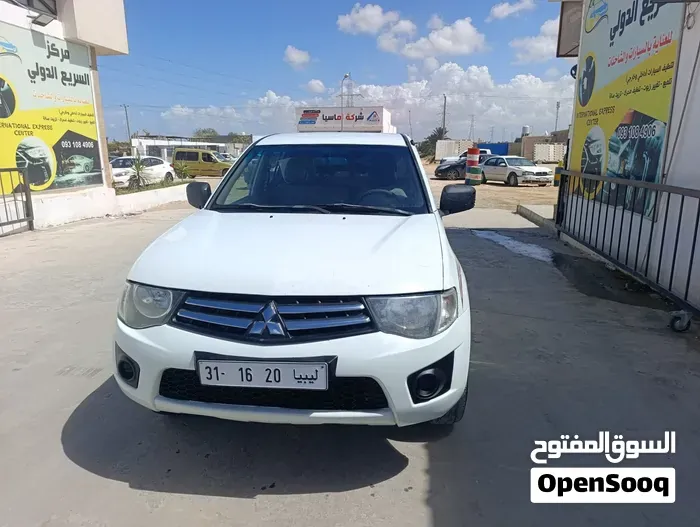 Mitsubishi L200 2010 photo 3