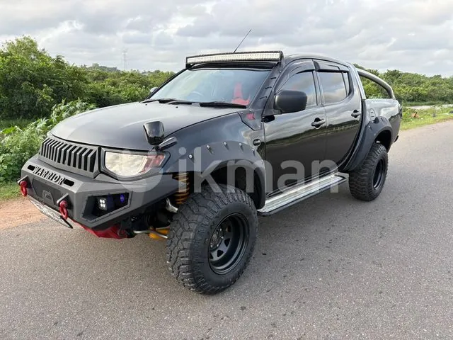 Mitsubishi L200 2007 photo 2