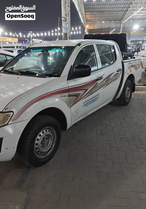 Mitsubishi L200 2013 photo 2