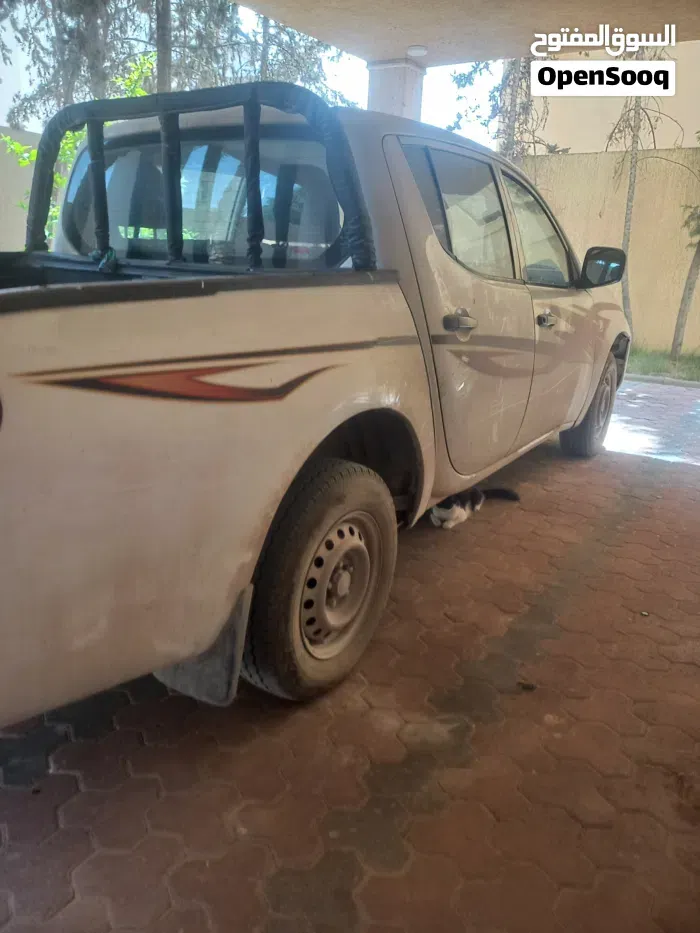 Mitsubishi L200 2010 photo 3