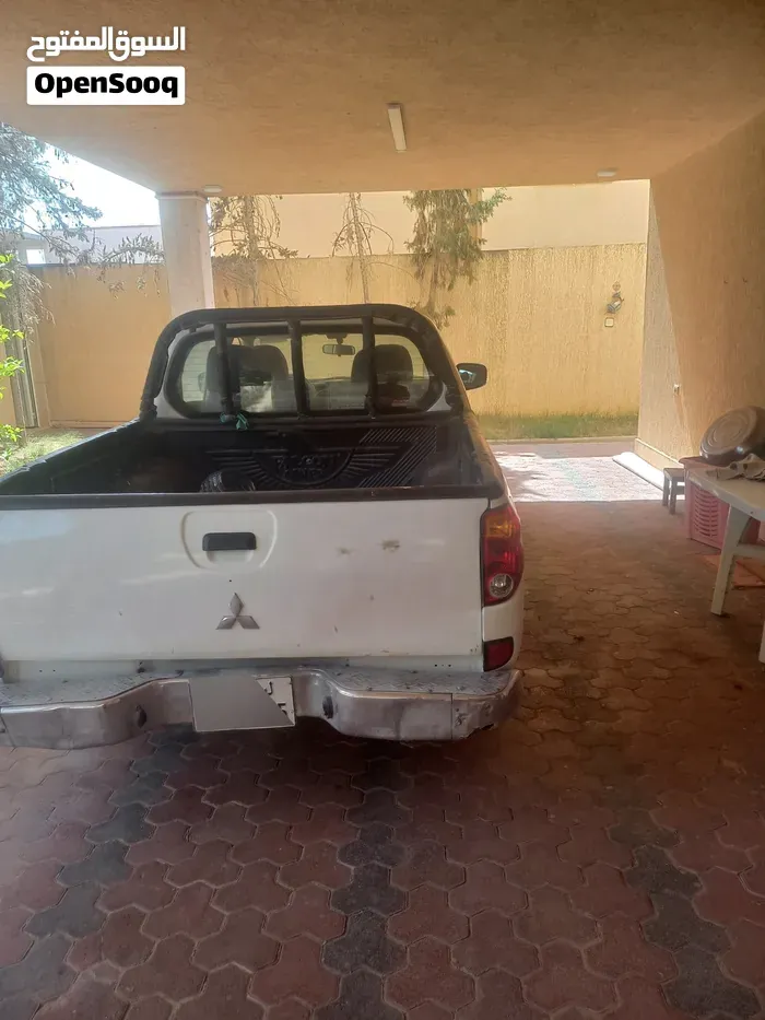 Mitsubishi L200 2010 photo 4
