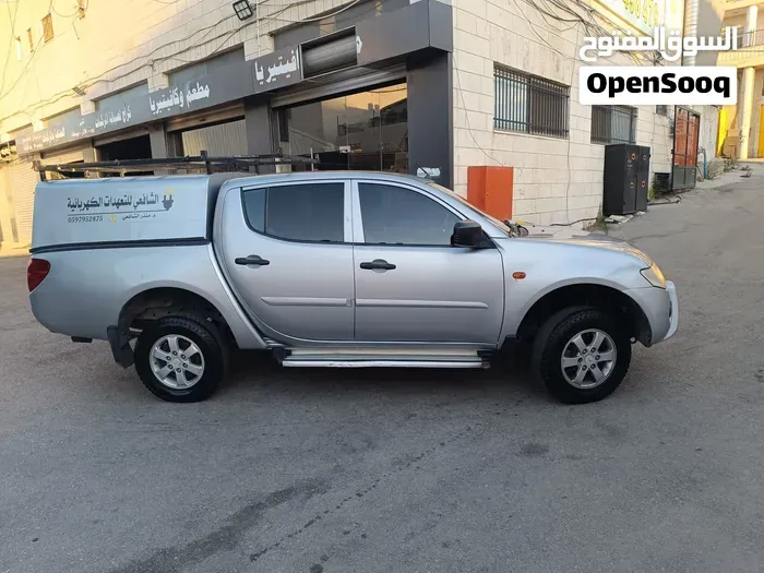 Mitsubishi L200 2009 photo 2