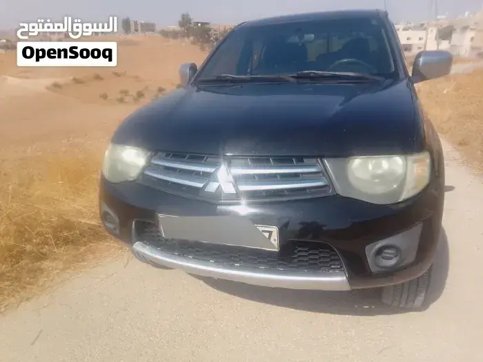 Mitsubishi L200 2010 photo 4