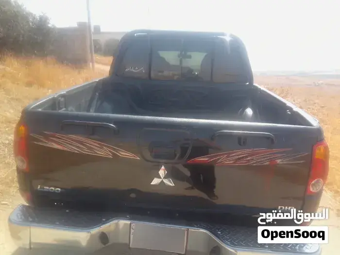 Mitsubishi L200 2010 photo 2