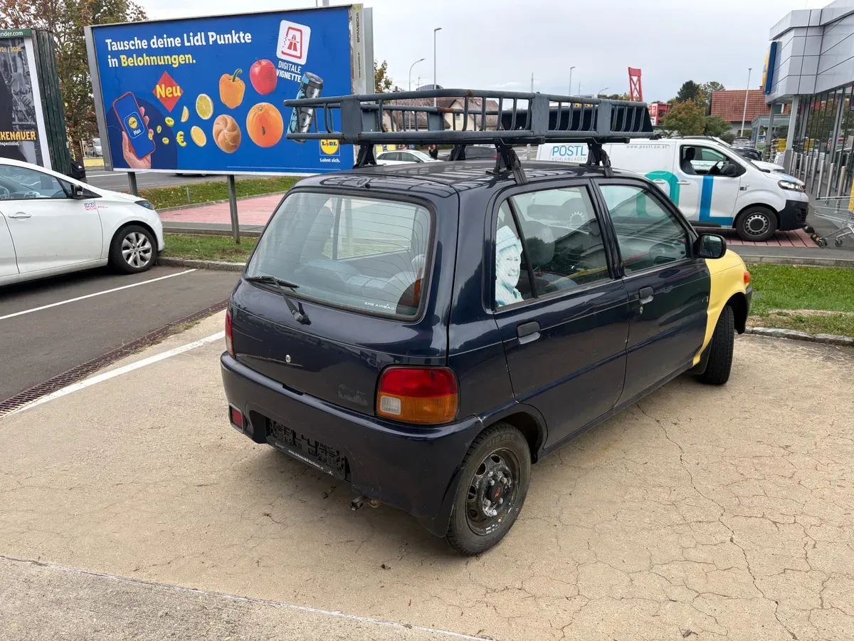 Daihatsu Cuore 1997 photo 3