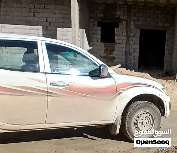 Mitsubishi L200 2010 photo 3