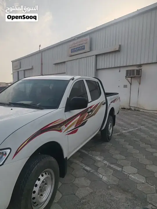 Mitsubishi L200 2012 photo 3