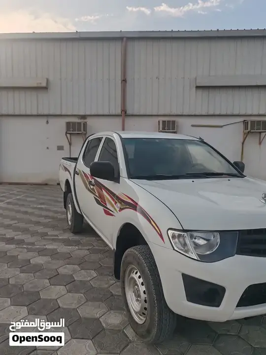 Mitsubishi L200 2012 photo 2