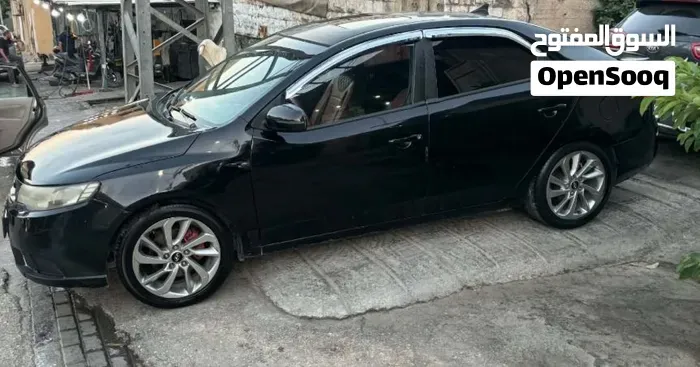 Kia K4 2008 photo 2