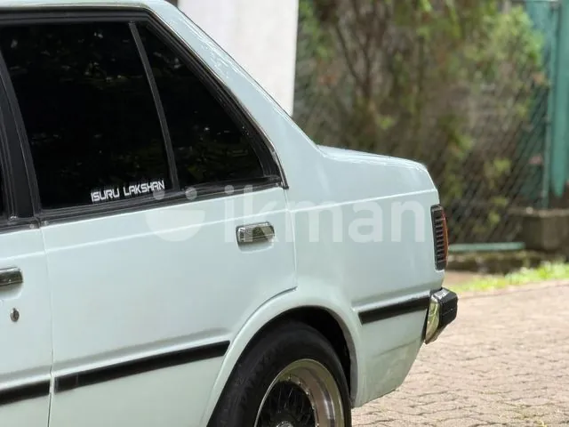 Nissan B11 1985 photo 2