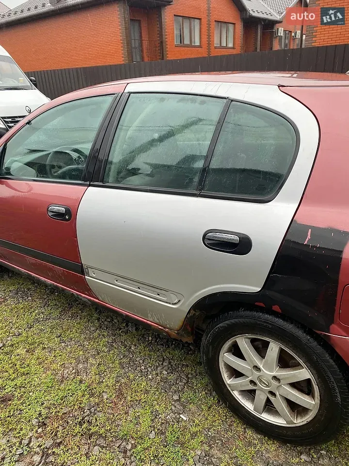 Nissan Almera 2001 photo 2