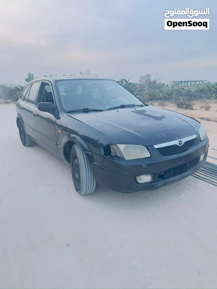 Mazda 323 2000 photo 4