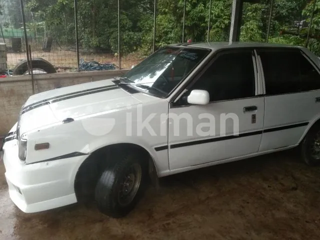 Nissan B11 1985 photo 4