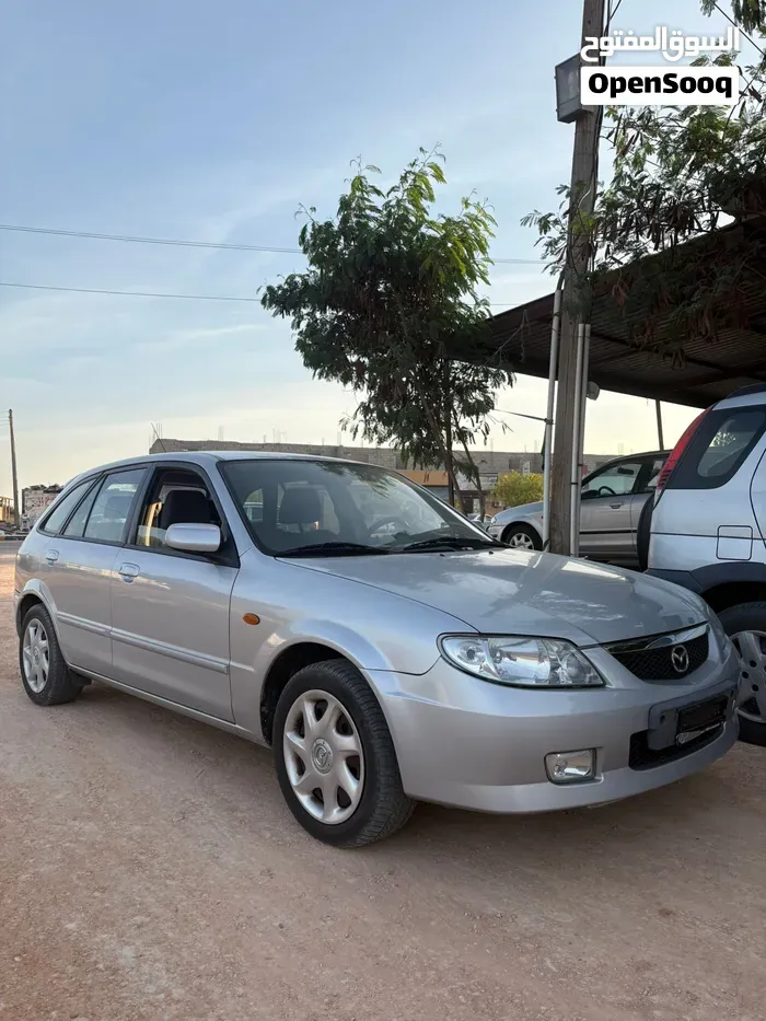 Mazda 323 2004 photo 2