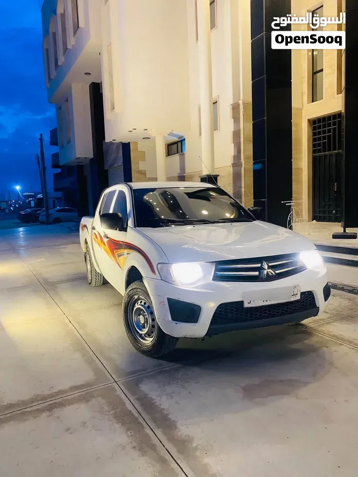 Mitsubishi L200 2010 photo 4