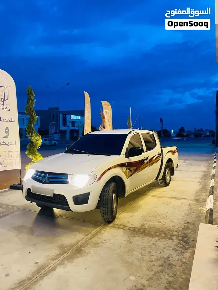 Mitsubishi L200 2010 photo 3