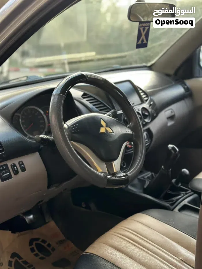 Mitsubishi L200 2014 photo 3
