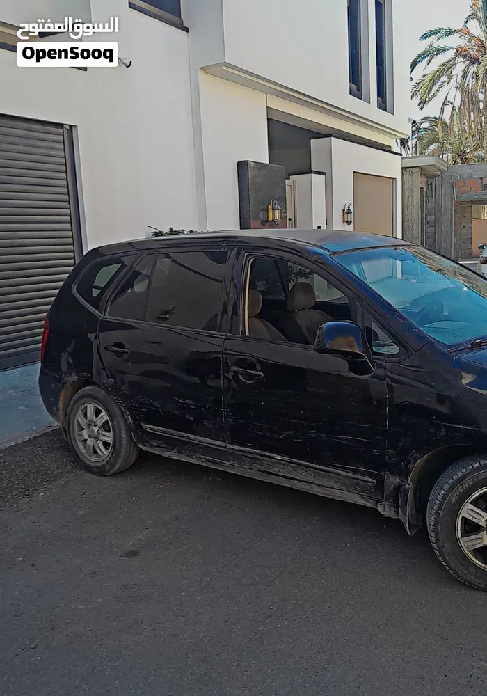 Kia Carens 2009 photo 2