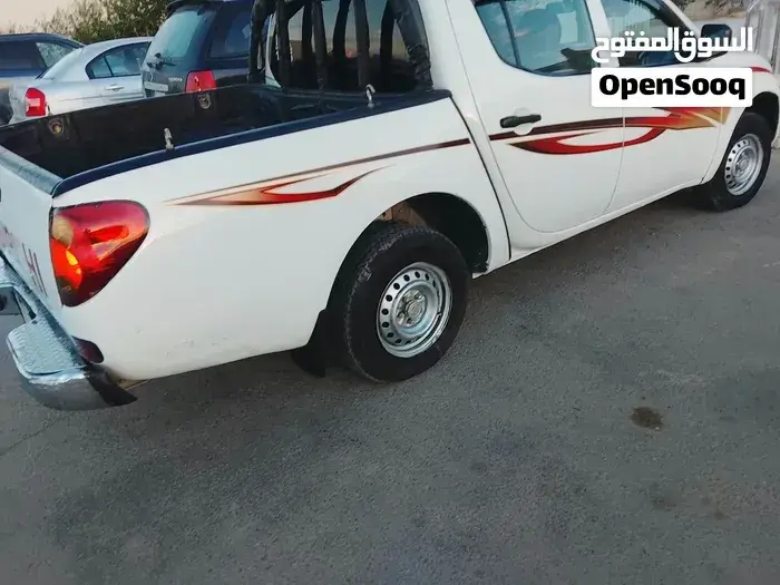 Mitsubishi L200 2010 photo 4