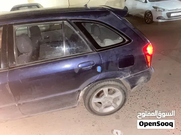 Mazda 323 2003 photo 2