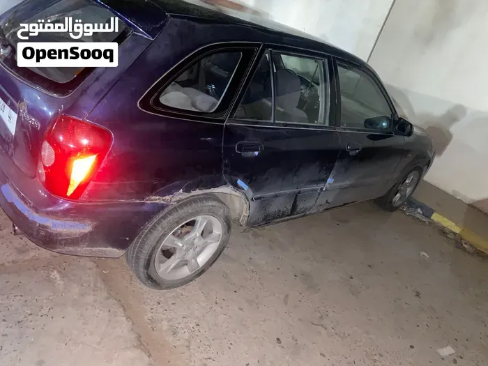 Mazda 323 2003 photo 4
