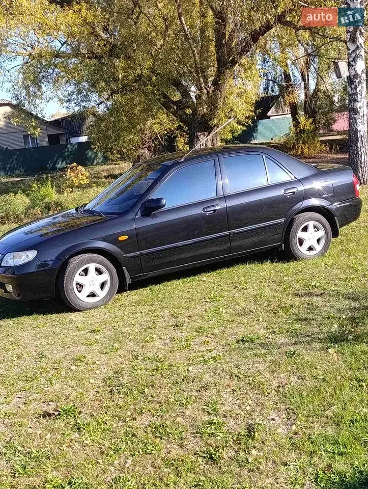 Mazda 323 2003 photo 2