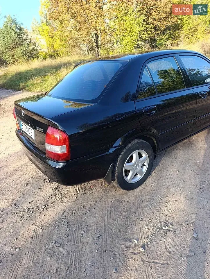 Mazda 323 2003 photo 4