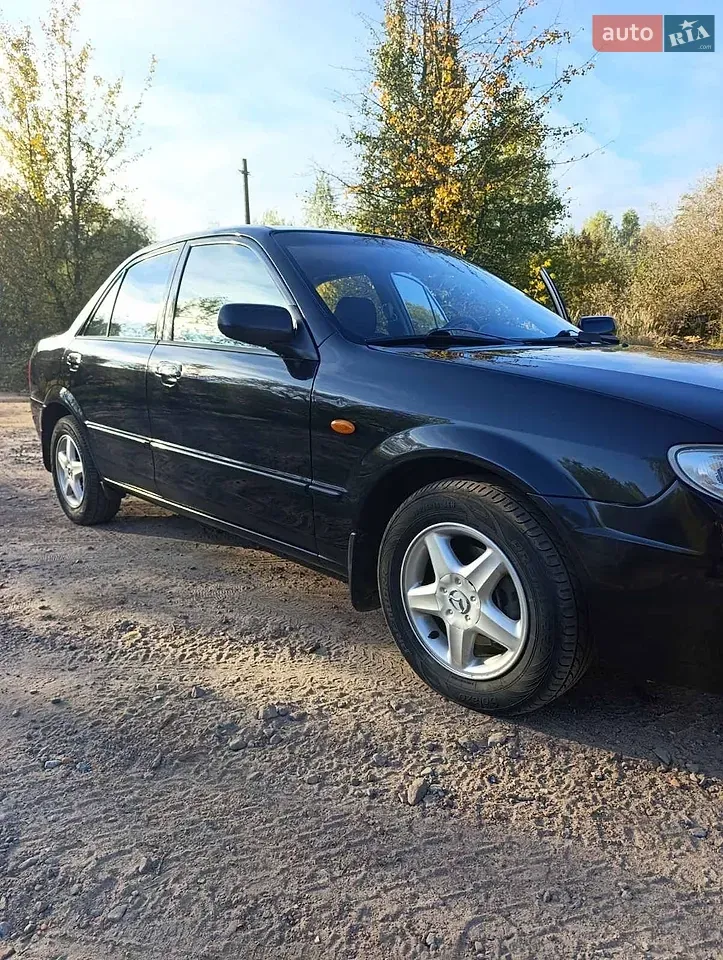 Mazda 323 2003 photo 5