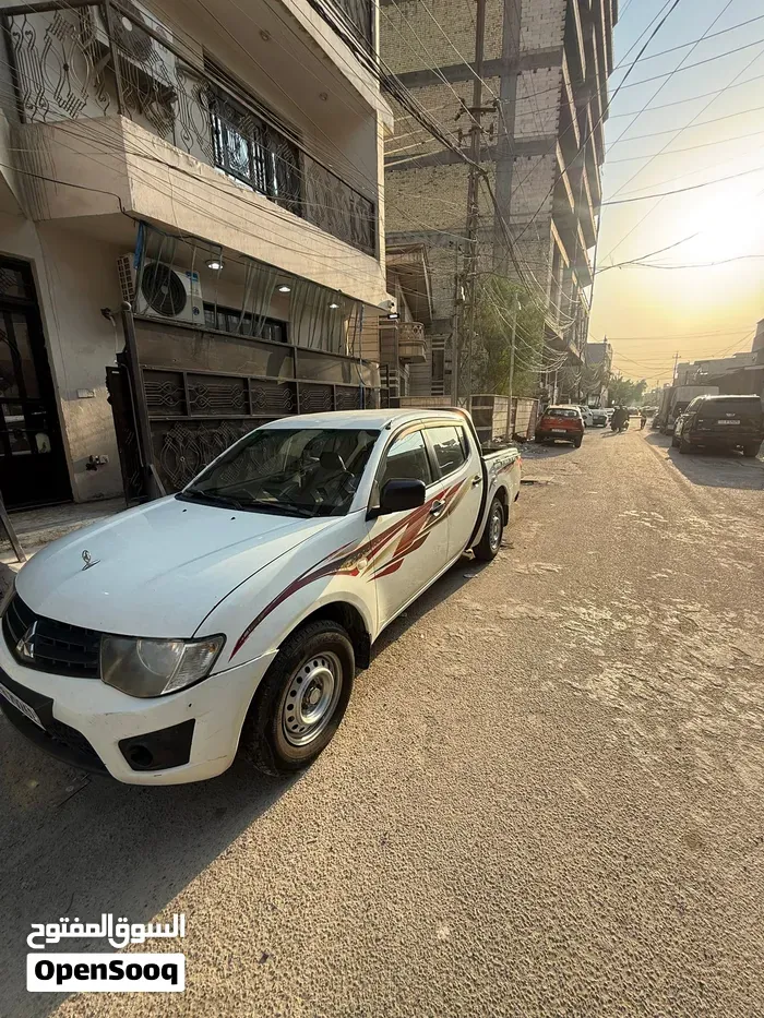 Mitsubishi L200 2014 photo 4
