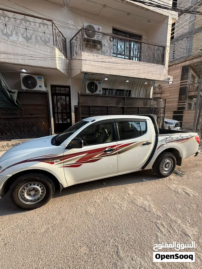 Mitsubishi L200 2014 photo 3