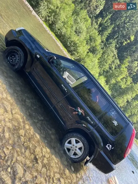 Nissan X-Trail 2003 photo 2