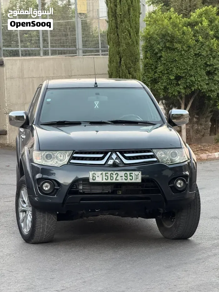 Mitsubishi L200 2014 photo 4