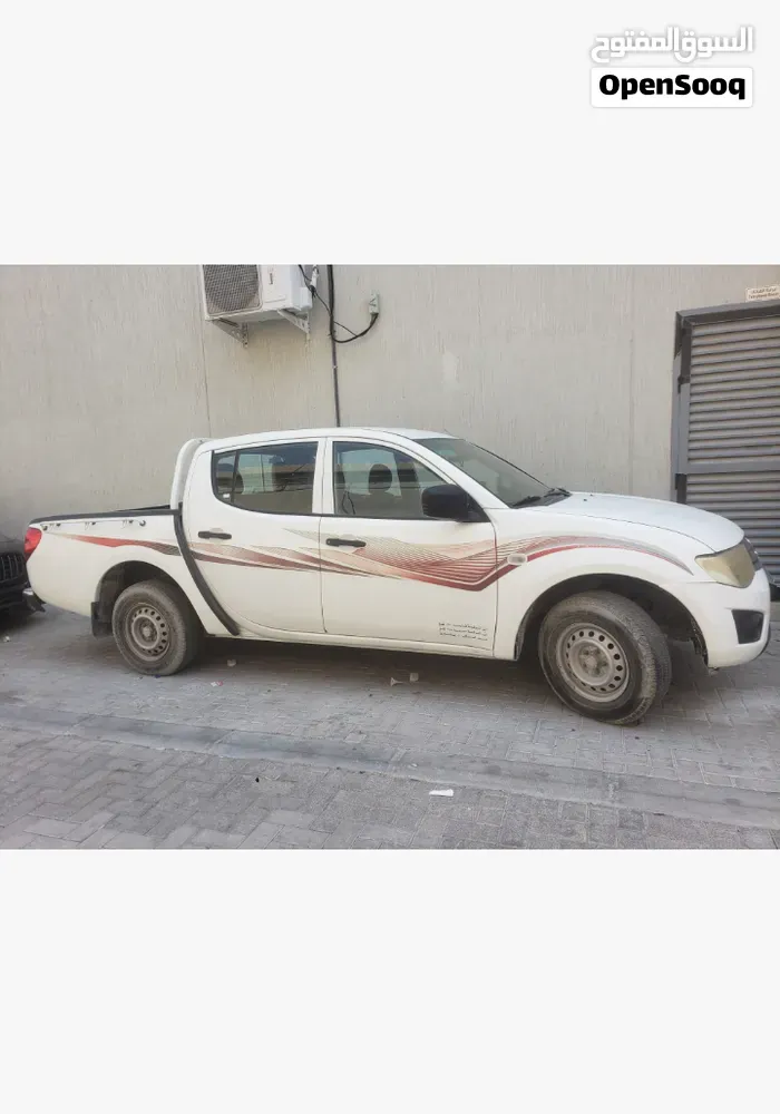 Mitsubishi L200 2011 photo 2