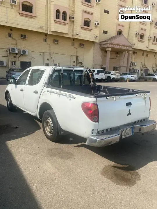 Mitsubishi L200 2010 photo 2