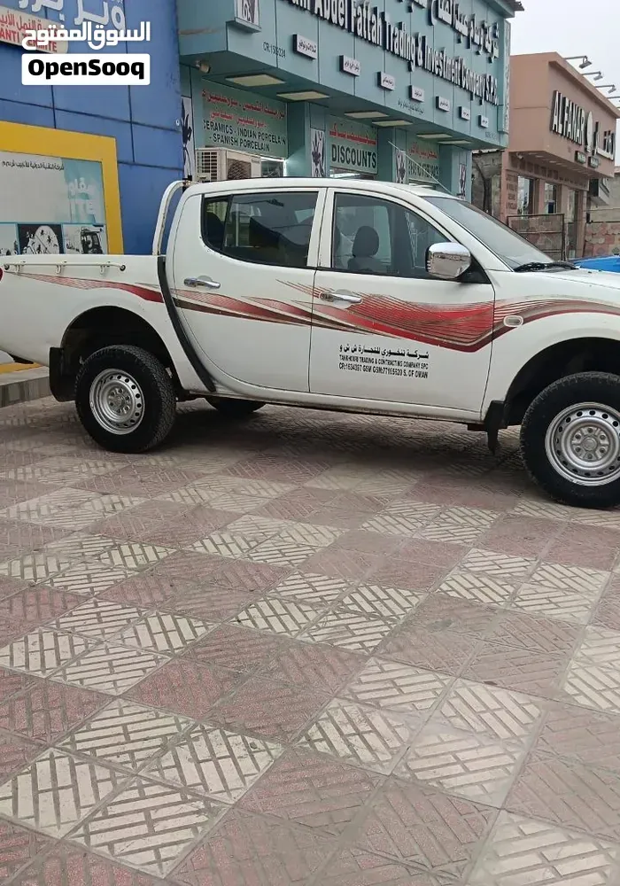 Mitsubishi L200 2011 photo 2