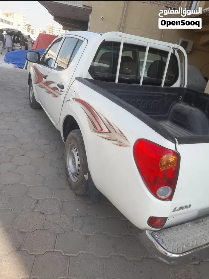 Mitsubishi L200 2013 photo 3